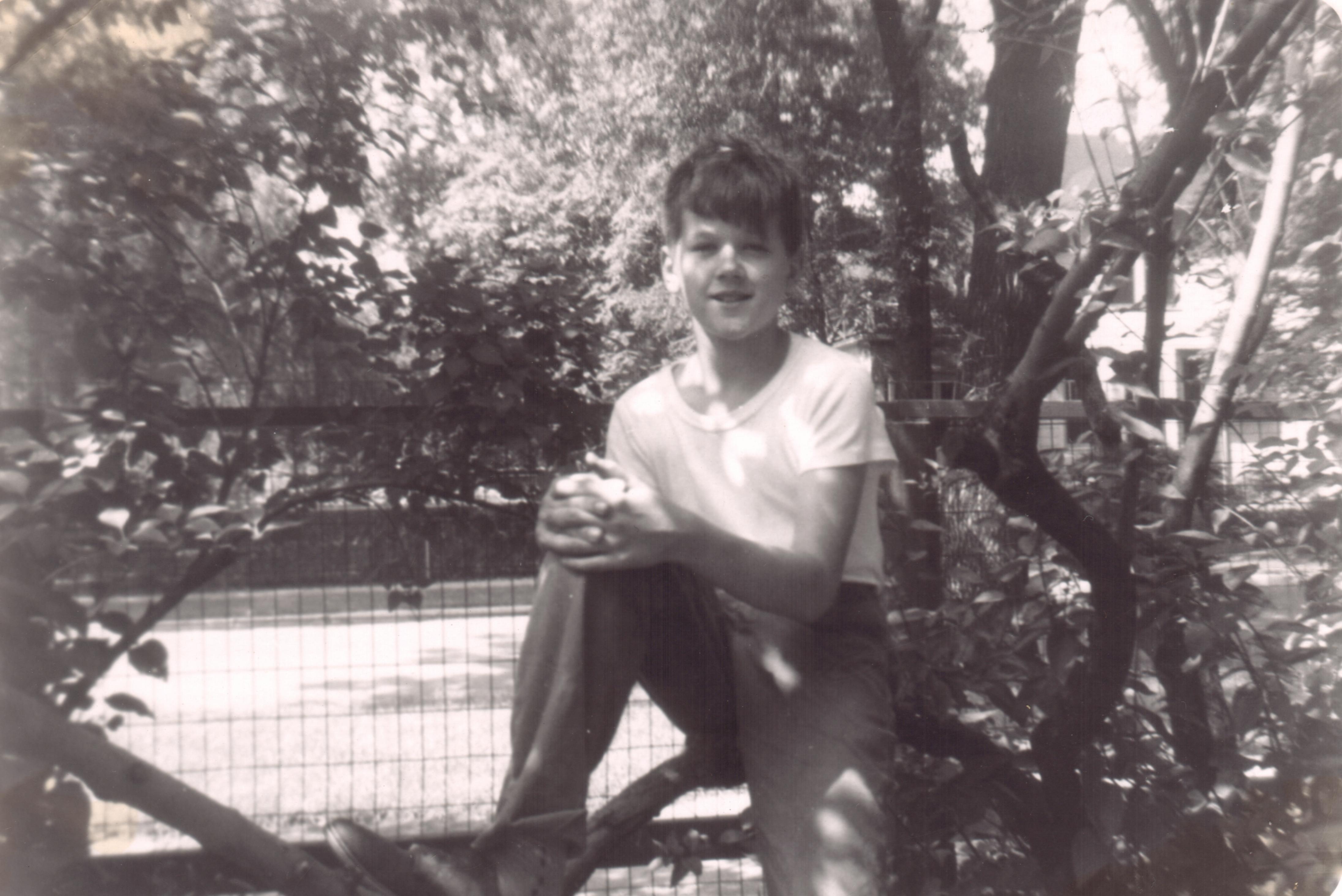 Picture taken in 1959 while sitting on the old lilac tree in the backyard of his home at 3756 No. Lowell Avenue in Chicago, Illinois.