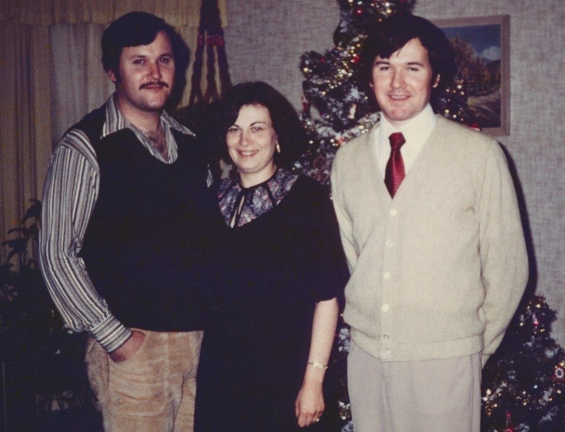 Norman Grasser's last photo taken of him on Christmas Eve in 1979, shown with his brother, Allen & Allen's fiancée, Marie.